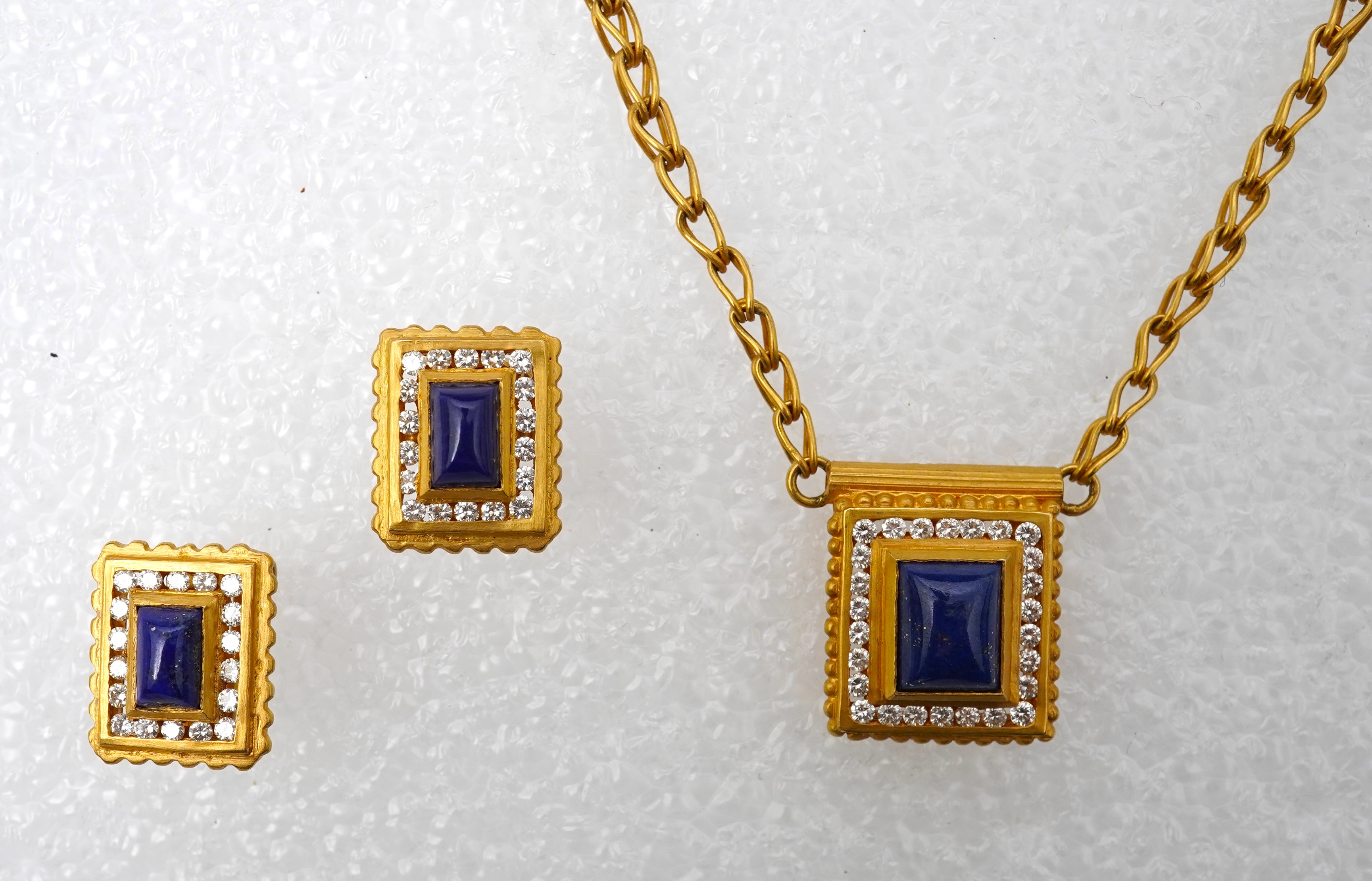 A lapis lazuli, gold and diamond demi-parure